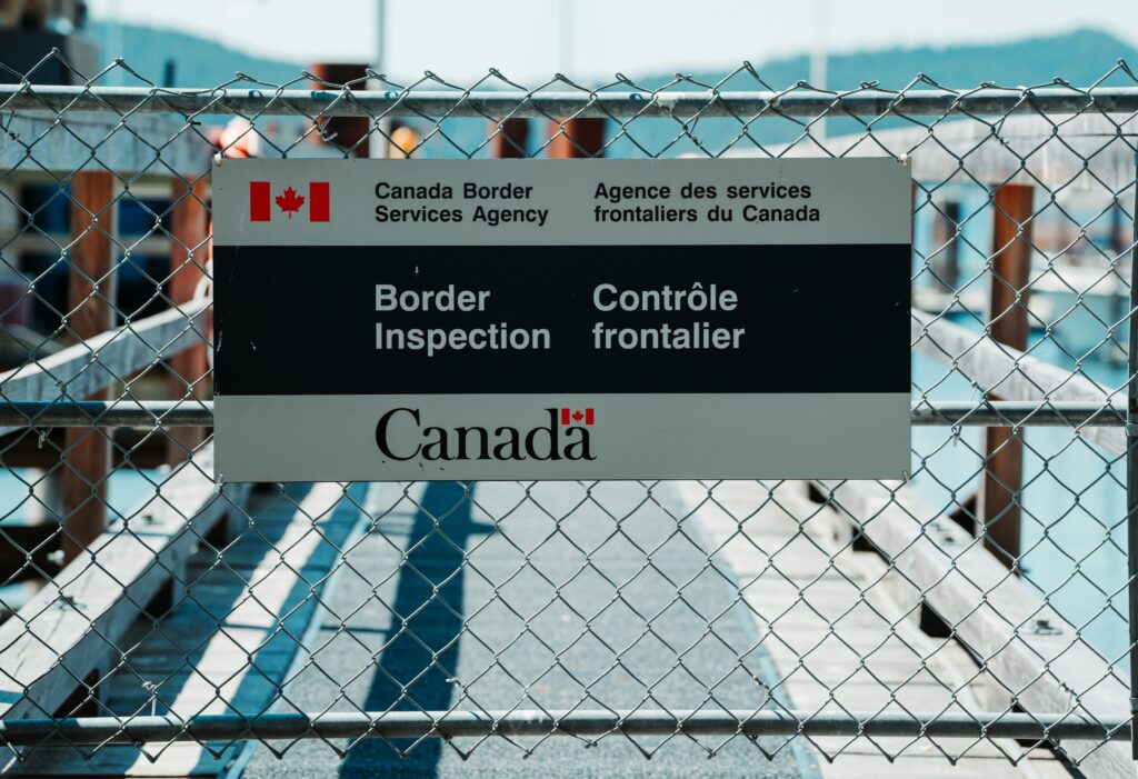 Canada Border Services Agency checkpoint sign at a border inspection area — essential for newcomers completing B4 and B4A customs forms before moving to Canada.